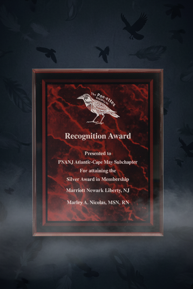 Recognition award with red marble background and black frame