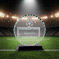 Round glass award with 'Achievement Award' text on a clear background