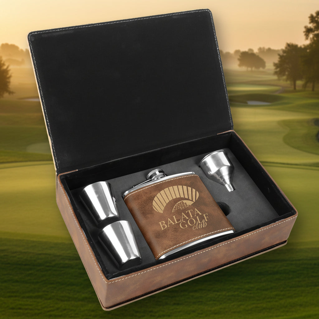 Flask set with brown leather case and silver components in a black box