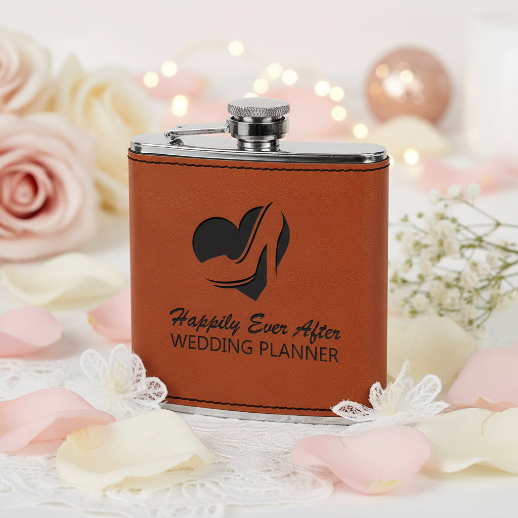 Brown leather flask with 'Happily Ever After Wedding Planner' text and logo on a white background