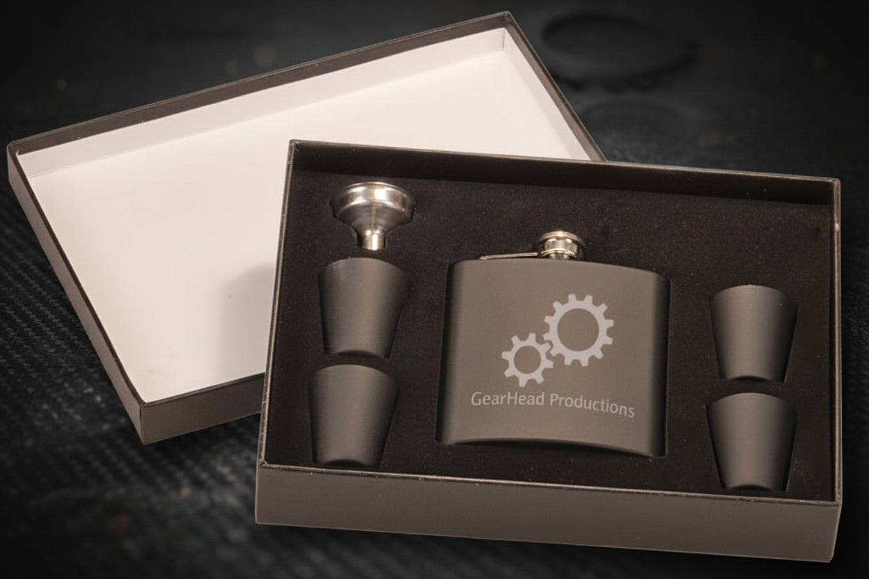 Black hip flask set with gear design and 'GearHead Productions' text in a box.