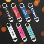 Set of eight branded bottle openers on a white background