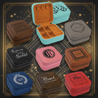 Collection of jewelry boxes in various colors with engraved text and designs.