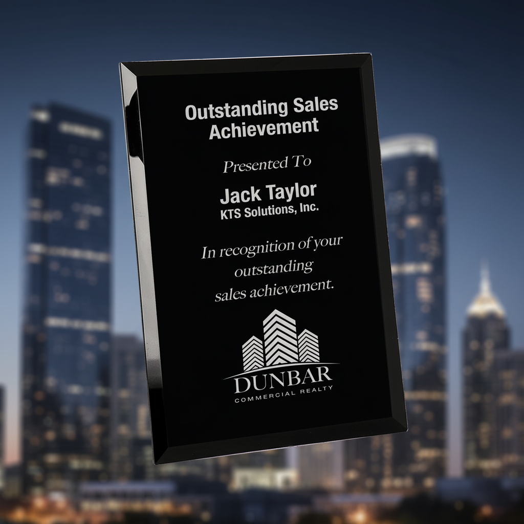 Black plaque with white text recognizing outstanding sales achievement to Jack Taylor of KTS Solutions, Inc.