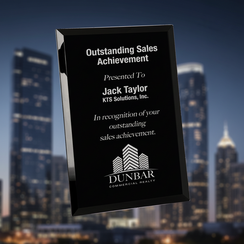 Black plaque with white text recognizing outstanding sales achievement to Jack Taylor of KTS Solutions, Inc.
