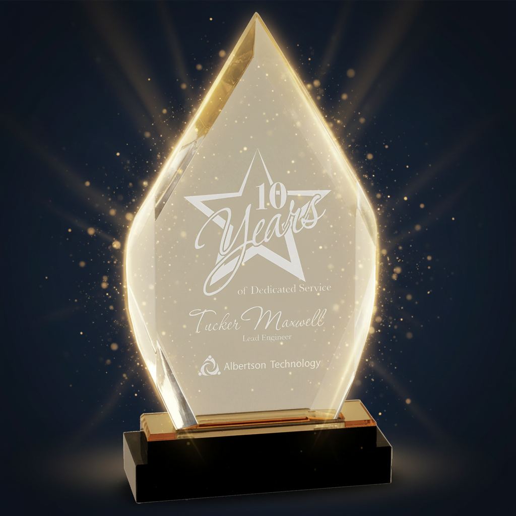 Glass award with engraved text on a clear background