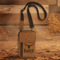 Brown crossbody bag with 'Ranch Longhorn' branding on a transparent background