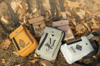 Four pouches with different designs and text on a grassy background