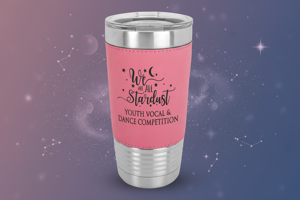 Pink tumbler with silver lid featuring text on a green background