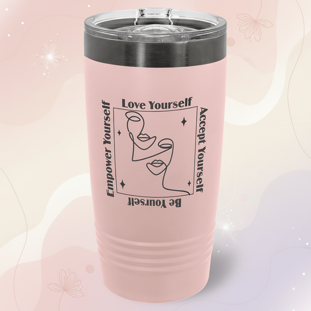 Pink tumbler with motivational text and face design on a green background
