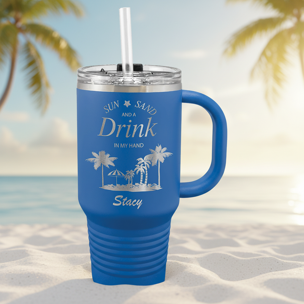 Blue mug with handle and straw, featuring palm tree design and text on a green background