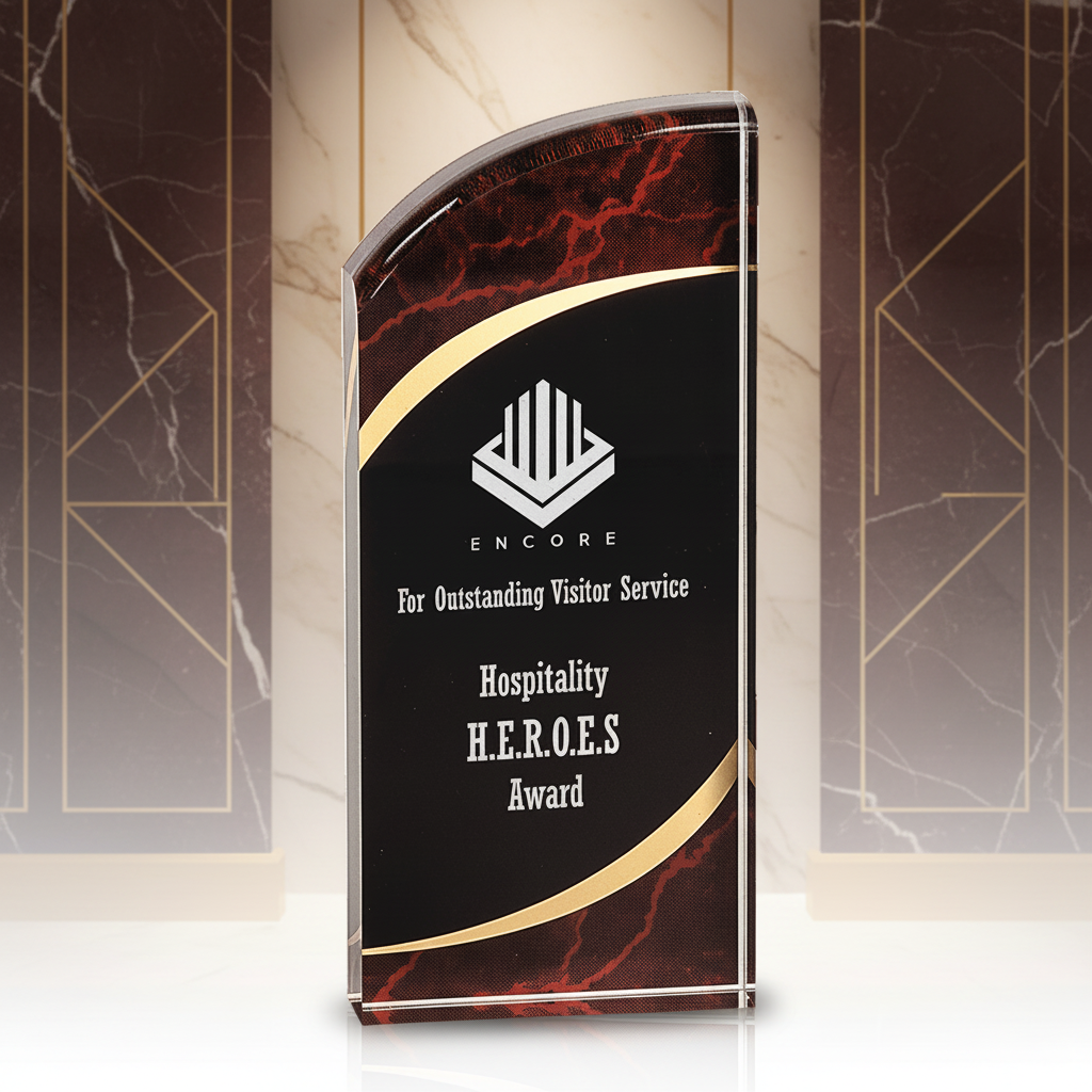 Decorative award with maroon and gold design on a clear background