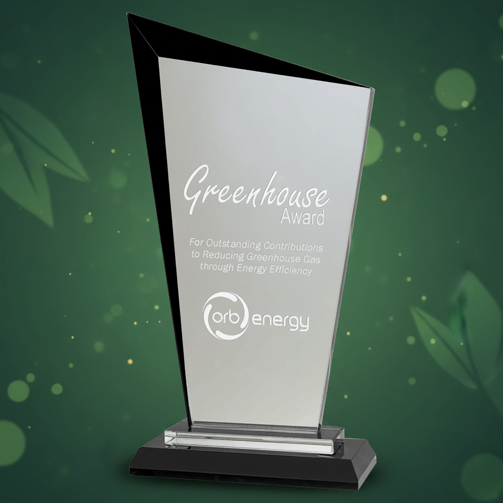 Glass award with black base on a clear background, featuring 'Greenhouse Award' and 'orb energy' logos.