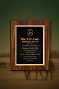 Wooden plaque with engraved text on a light blue background